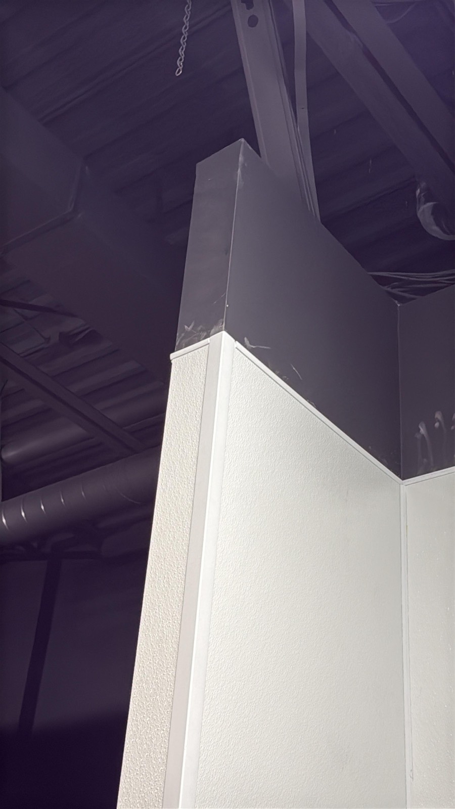 FRP outside corner trim capping a textured wall panel