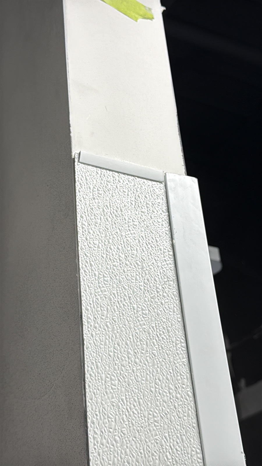 Textured embossed FRP wall panel with division bar